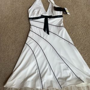 Fun new Party Dress. White with black accents. Ruffled skirt underneath.